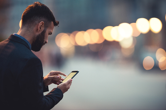 Man with mobile device